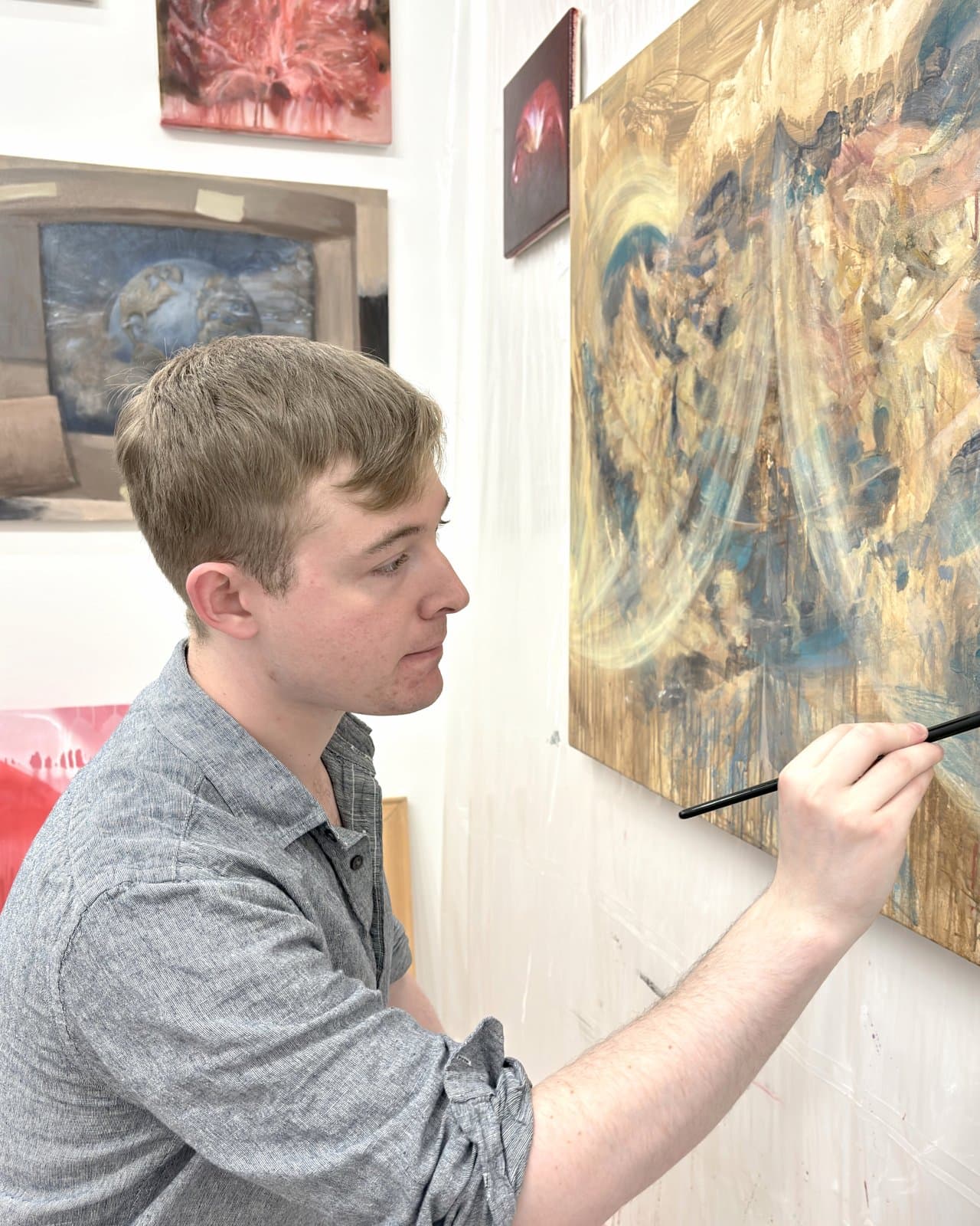 Connor Gewirtz painting in his studio