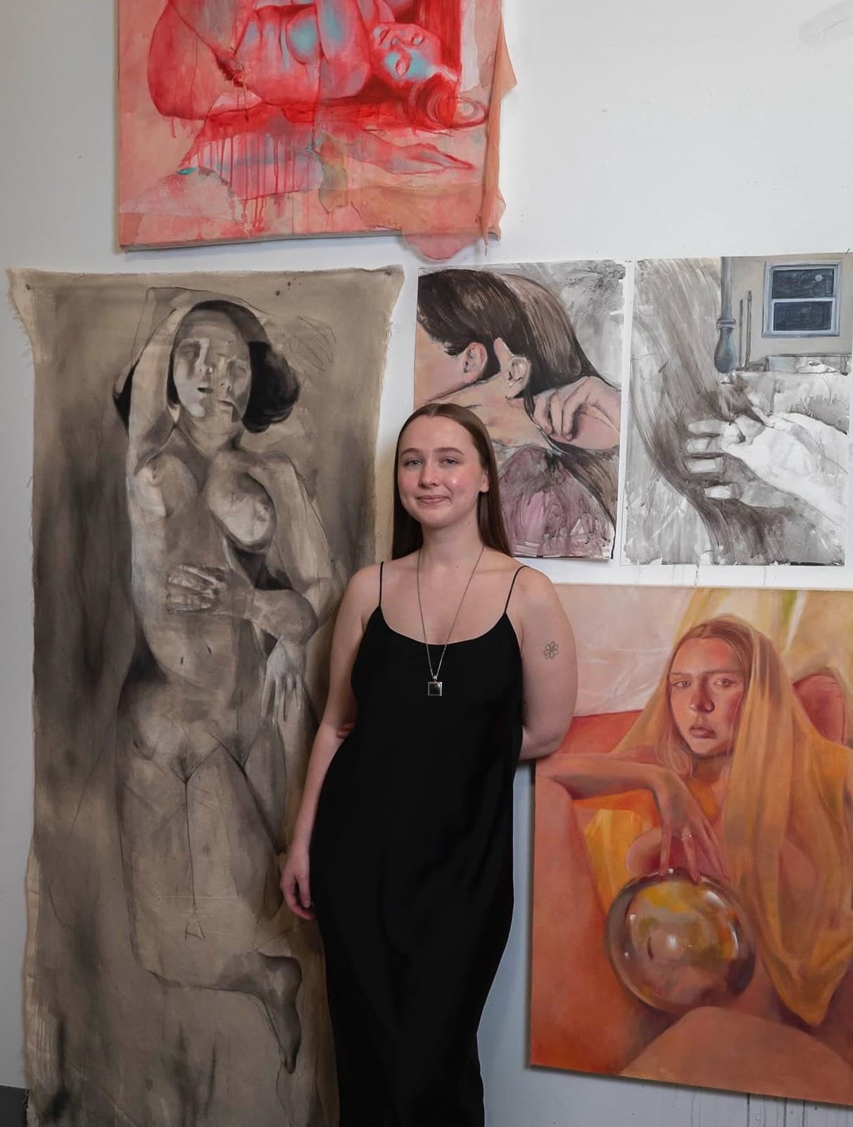 Artist Lilli Cordes in her studio, in front of her paintings